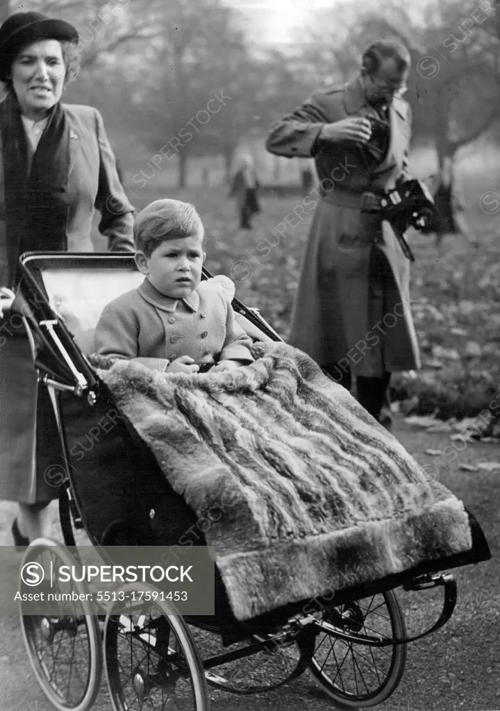 Birthday outing for Prince Charles -- A fur rug keeps Prince Charles warm on his third birthday outing in Green Park today. Prince Charles today celebrates his third birthday and as usual ***** outing in Green Park near his ***** home. In the absence of Princess ***** and the Duke of Edinburgh his grandmother of the Queen is supervising the birthday party arrangements. November 14, 1951. (Photo by Fox Photos).