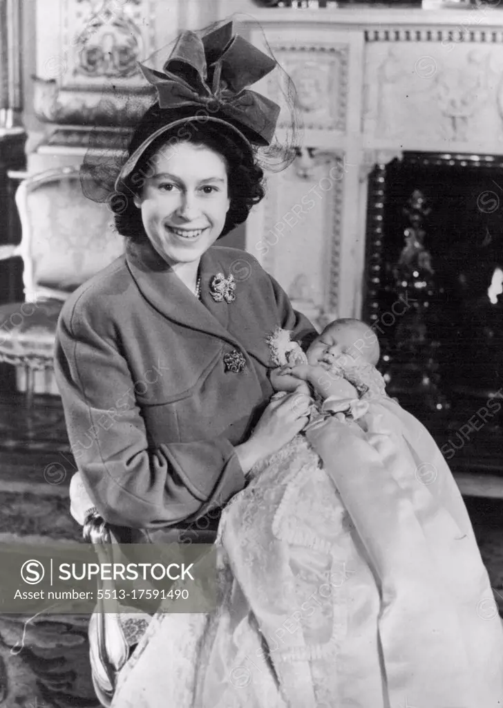 Royal Baby Christened - First First picture of Prince Charles here seen held in the arms of his mother, Princess Elizabeth - after the baby Prince was christened by Dr. Geoffrey Fisher, the Archbishop of Canterbury in a ceremony at Buckingham Palace. Named Charles Philip Arthur George. December 15, 1948. 