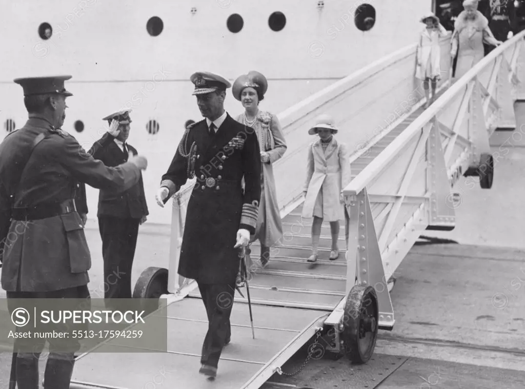 Royal Canadian Tour: Welcome Home -- Our photograph shows the arrival of Their Majesties at Southampton yesterday, June 22. The King is seen stepping ashore from the liner Empress of Britain and he about to shake hands with Lord Mottistone, Lord Lieutenant of Hampshire. The Queen and Princess Margaret are just behind, and Queen Mary and Princess Elizabeth can be seen at the top of the gangway. July 11, 1939. 
