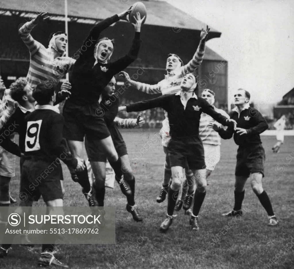 An Oxford Rugby Union forward goes high into the air to beat his rivals for the ball in a line out during the annual match against Cambridge at Twickenham. Oxford won 9-5. December 29, 1955. (Photo by Sport & General Press Agency, Limited).