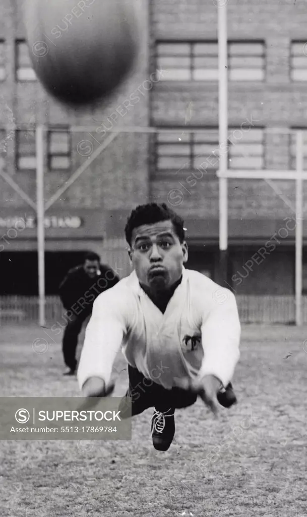 Fijian RU - Away it goes. Vatubua grimaces as he throws himself and ball into the air. July 26, 1952.