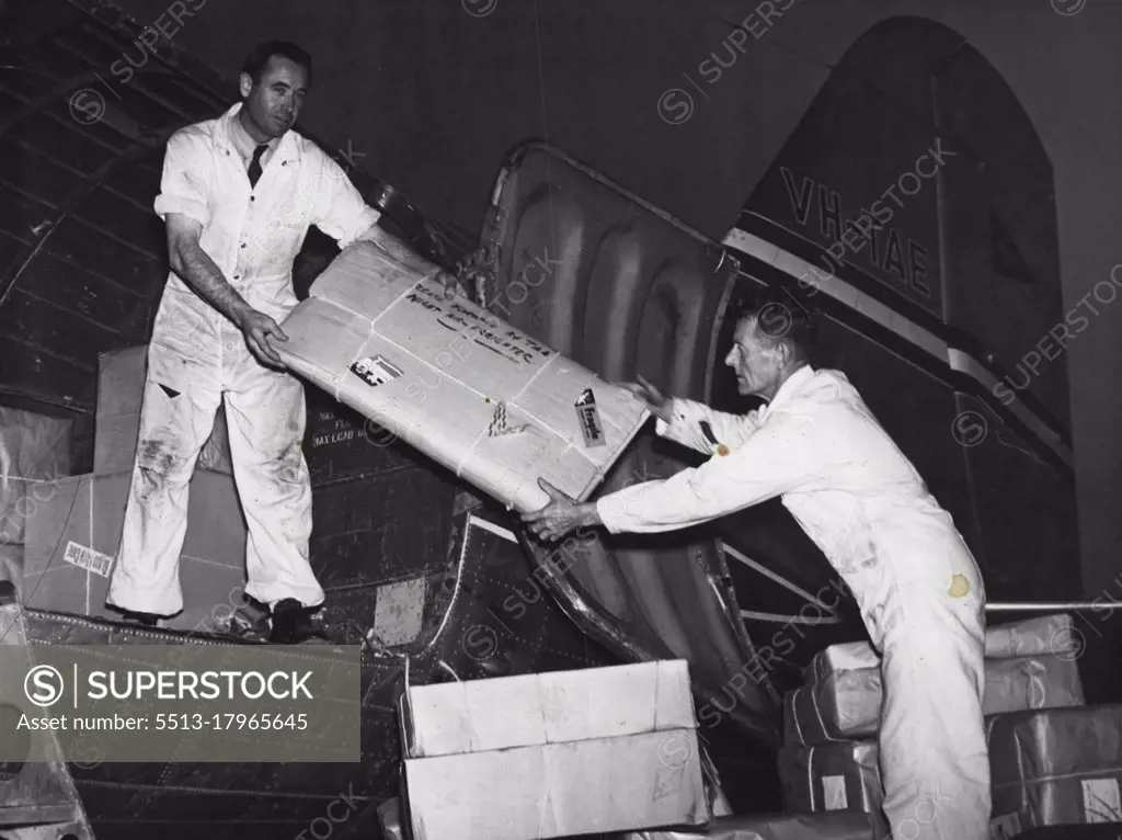 Night Freighter Series: Loading of freight into aircraft at Essendon. April 17, 1950. (Photo by TAA Photograph).