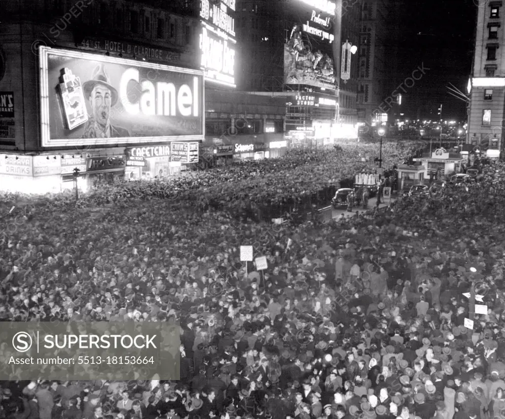 Happy New Year.A crowd estimated by New York police at 900,000 persons fills times Square, at midnight, Dec.31, to welcome in the New Year. Revelers pushed and Jostled each other moments before the "Bewitching Hour", cut at the stroke of midnight each turned to the other to bid him "Happy Returns of the Day." Photo made from A Balcony on the Hotel Aston on Broadway between 44th and 45 streets. January 1, 1947. (Photo by Associated Press Photo).