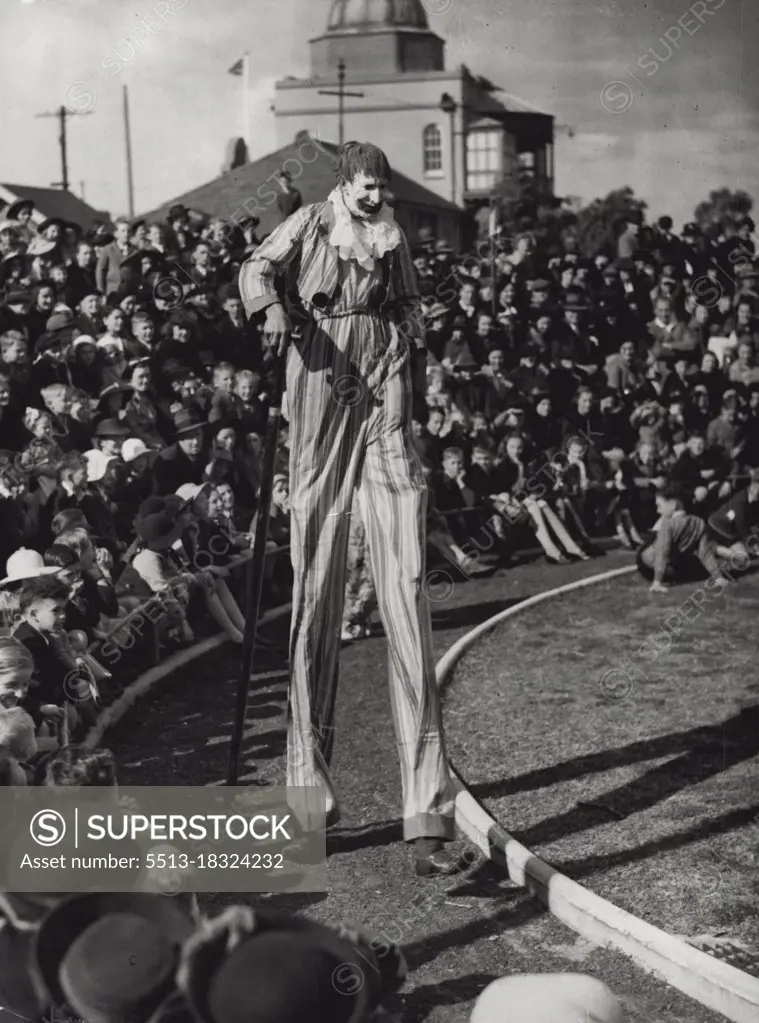 Clown on Stilts : Children were entertained at a circus party at Taronga Park Zoo yesterday. The clown on stilts, with his enormous walking stick, brought many a laugh. October 09, 1939.