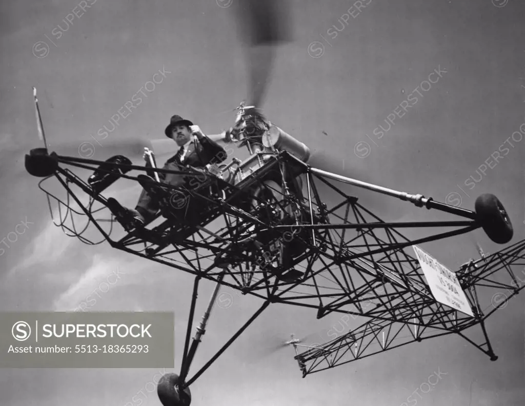 In this helicopter, inventor Igor Sikorsky literally hung in the air near Bridgeport, Conn., for one hour, 32 minutes and 30 seconds to break all existing records for this type machine. Inventor Sikorsky doesn't have to remove his hat or don a flying helmet because the down draft from the motor keeps his hat jammed to his head. May 08, 1941. (Photo by International News Photos).