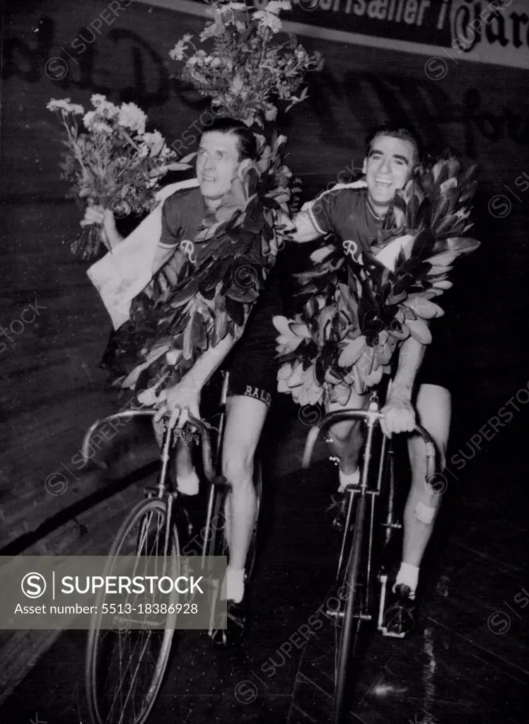 Australians Win Danish Race -- Garlanded winners Alfred Strom, left, and Sidney Patterson, both of Australia, after winning the six-day Danish Cycle race at Aarhus, November 12. Riding as a team they covered 3,268 kilometers. November 15, 1954. (Photo by Associated Press Photo).