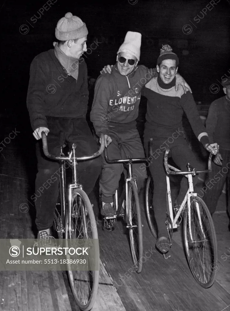 Riders Relax In "Six-Day" -- Left to Right, they are : Belgian Rider - Spelte; Ferdinando Terruzzi of Italy; and Australia's Alfred Strom. The friendly chat of these three riders during the six-hour slow speed rest periods turns to intense rivalry and furious competition when they go all out in the night sprints in Berlin's first postwar six-day cycle race which began December 1. December 07, 1949. (Photo by Associated Press Photo).