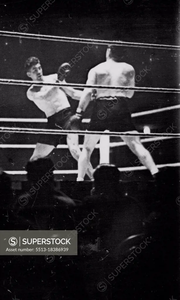 Loughran Beats Strickland At Wembley -- An incident during the fight between Tommy Loughran of America and Maurice Strickland of New Zealand, at the Empire Stadium, Wembley. Loughran was the winner on points. November 12, 1935. (Photo by Keystone).
