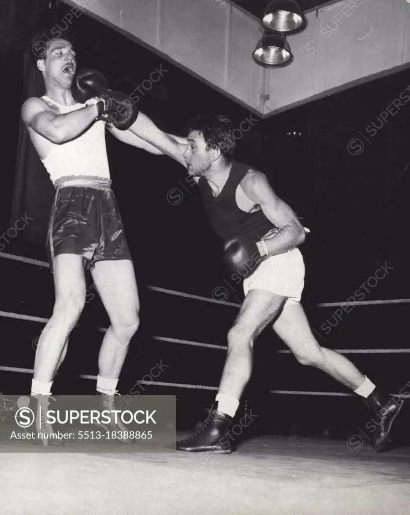 The Long and the Short of It.Dieter Wemhoefer of West Berlin (right) hand to really stretch to connect with the chin of Bulgaria's Peter Apasoff in the Middleweight division of the European Amateur boxing championships in Berlin, but the hometown boy won on points. June 01, 1955. (Photo by Paul Popper, Paul Popper Ltd.). 