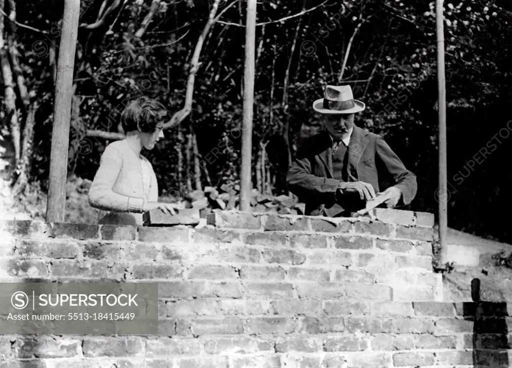 Mr. Churchill buildings his Own HouseGeneral view of Mr. Winston Churchill and his daughter at work bricklaying at Westeham, Kent.1936: Politics, landscape-painting, plumbing: he was at home with all of them. But for many years hobby was bricklaying. Here he is seen at work  on a garden wall at this home. September 03, 1928. (Photo by Topical Press).