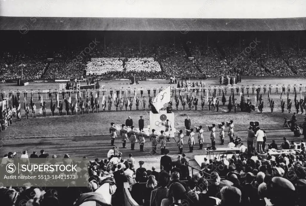Closing Of The Games Of The XIV Olympiad: A general view of the Closing of the Games of the XIV Olympiad at Wembley Stadium, London, August 14th. At foreground, State Trumpeters sound a Fanfare. Seen on the Tribune of Honour is Sir Frederick Wells, Lord Mayor of London. (Obscured by flag is Sigfrid Edstrom, President of the International Olympic Committee). Standing on the right of Tribune is Lord Burghley, Chairman of the Organising Committee. Behind the Tribune are paraded the flags of the competing nations. August 14, 1948. (Photo by Reuterphoto).