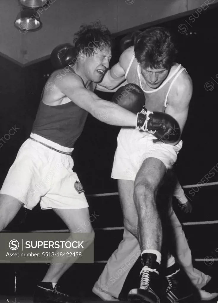 Getting It In  The Neck - Punkten (left) and Nitzschke, both from behind the iron curtain, Hammer each other in their Middleweight contest in the European boxing championships now being held in Berlin.Both boxers seem unable to look each other in the face and if Punkten doesn't open his eyes he'll find himself drawn onto a lovely left. May 30, 1955. (Photo by Paul Popper Photo).