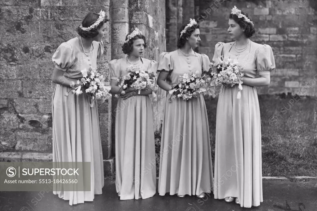 Three Princesses Are Bridesmaids At Romsey Abbey Wedding : The bridesmaids at this afternoon's Romsey Abbey wedding. Left to right, the Hon. Pamela Mountbatten, Princess Alexandra of Kent, Princess Margaret and Princess Elizabeth. The ancient town of Romsey, in the New Forest, was en fete to-day (Saturday). Thousands came from far and wide to see the Hon. Patricia Mountbatten, 22-years-old daughter of Viscount Mountbatten of Burma, married to Captain the Lord Brabourne, the Coldstream Guards, at Romsey Abbey. Three Princesses were bridesmaids. October 26, 1946.