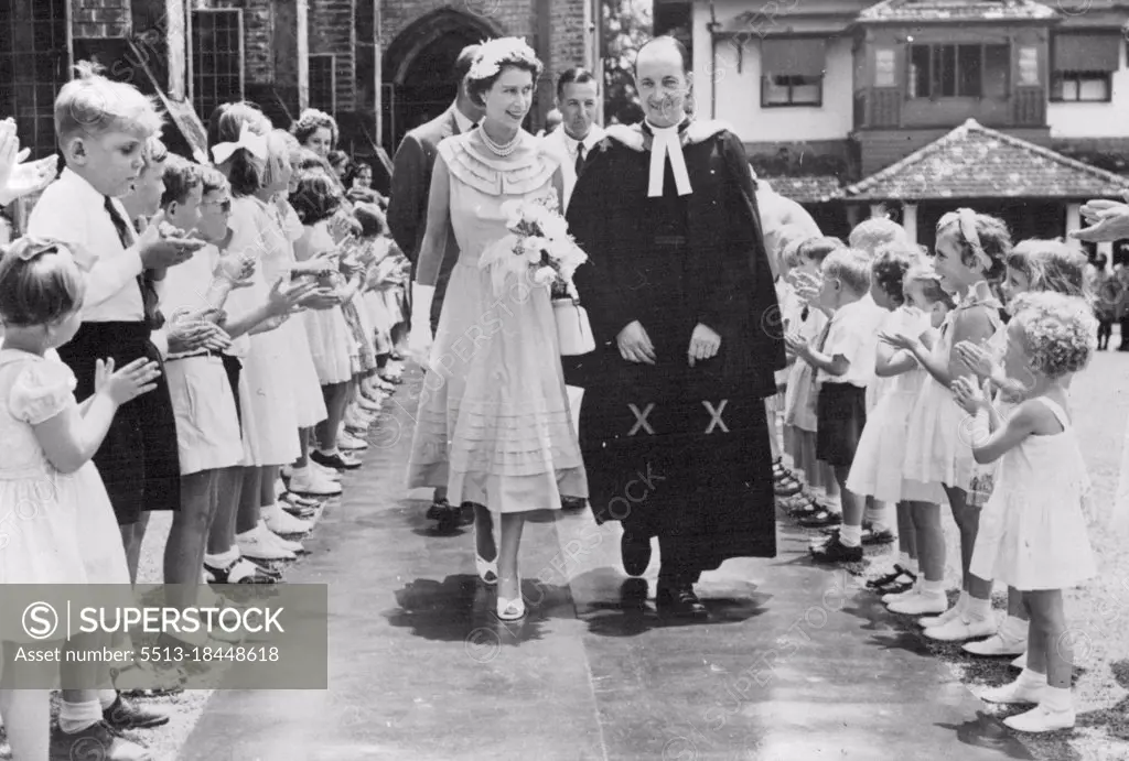 The Royal Tour: The Queen In Ceylon -- A charming picture as H.M. The Queen leaves after attending Divine Service at the Church of St. Michael & All Angels at Polwatte. Children from the Sunday School lined up to greet Her Majesty. April 17, 1954. (Photo by Sport & General Press Agency, Limited)