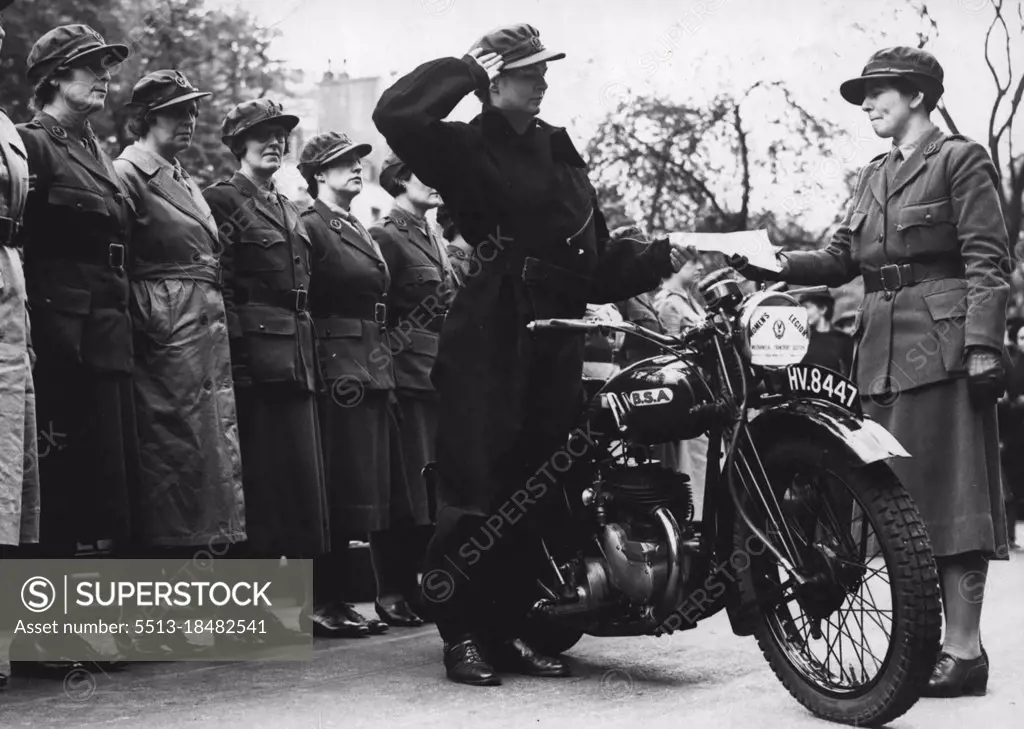 The Women's Legion, Mechanical Transport Section (Country Of London), Hold A London Route Rally - So as to familiarize the drivers with the quickest and best routes for reaching hospitals, main stations etc. A women dispatch rider hands the Company Commander, Country of London, a message during the really. May 6, 1939. (Photo by Sport & General Press Agency, Limited).