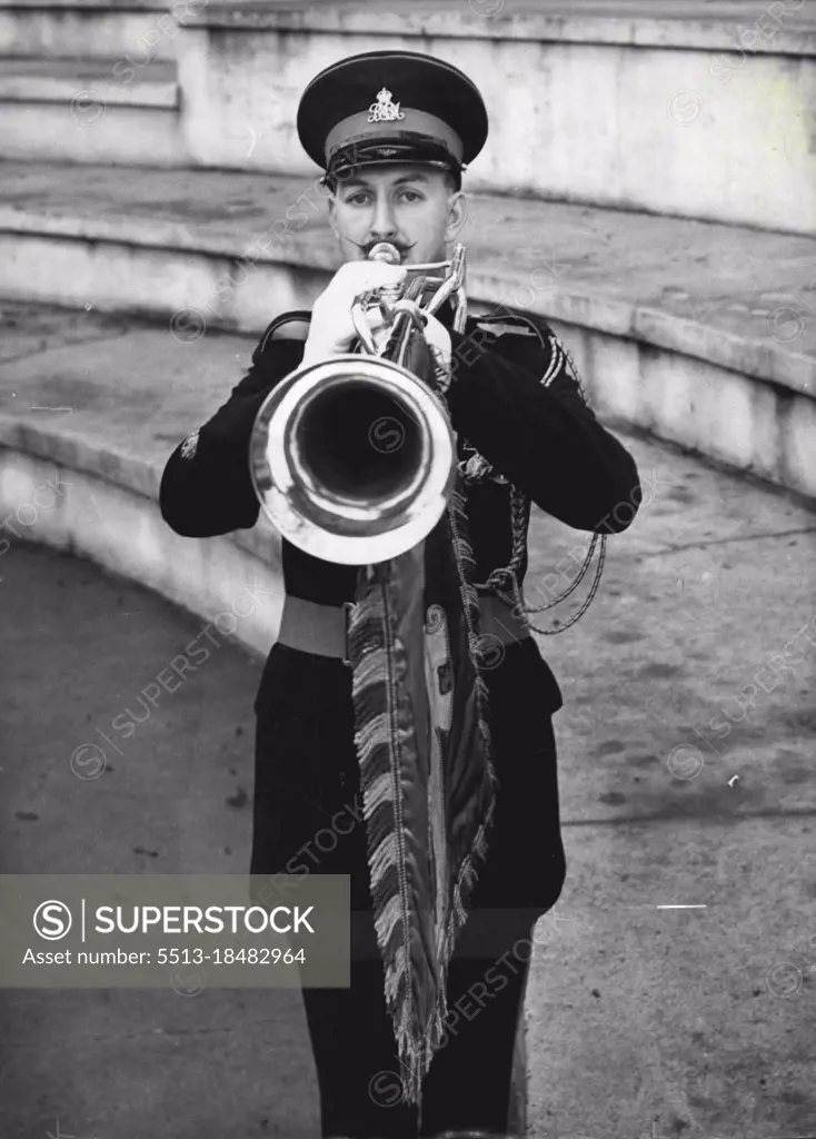 Coronation 'Solo' -- Waxed moustaches peak about his trumpet as student bandmaster A. Parker of Belfast sounds a fanfare at Kneller Hall - the Army musicians school at Twickenham, Middlesex, where trumpeters are training for Coronation duties in Westminster Abbey. January 29, 1953. (Photo by Reuterphoto).