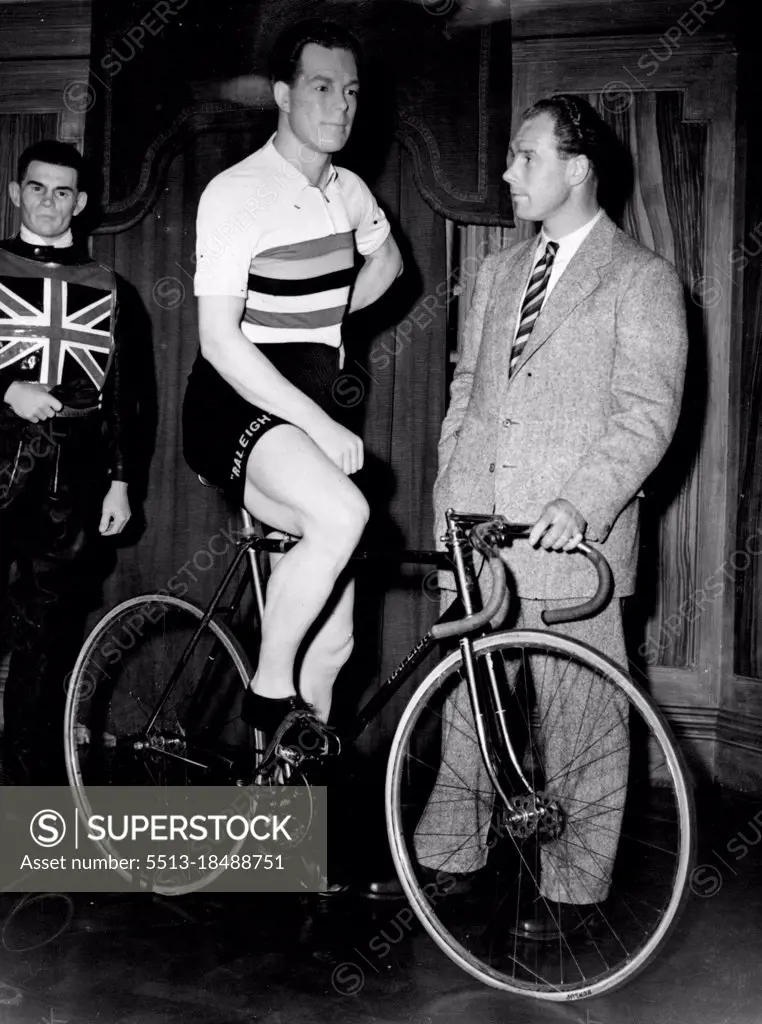 "So This Is Me" -- Still life study of speedman (himself) faces Reg Harris at Madame Tussaud's. Where he was placed on show in effigy today as World Professional Cycle sprint champion and twice-elected sportsman of the year. London's Famous Waxworks is used to difficult jobs. But fixing Harris in Wax was as hard as most: Cuicksilver might have been easier.Four expert were four months making the model high cost £500, in a difficult pose on bicycle but with the weight on one toe. Tyres are filmed neither with air nor wax - the inner tubing is water. August 14, 1951. (Photo by Paul Popper, Paul Popper Ltd.).