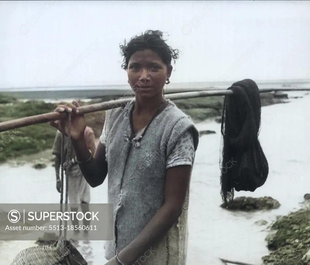 Daman -- Many Damanites, like this woman, fish for a living. Virtually blockaded, Daman still has enough food. Heavy rains have made vegetables plentiful. September 24, 1954. (Photo by United Press).