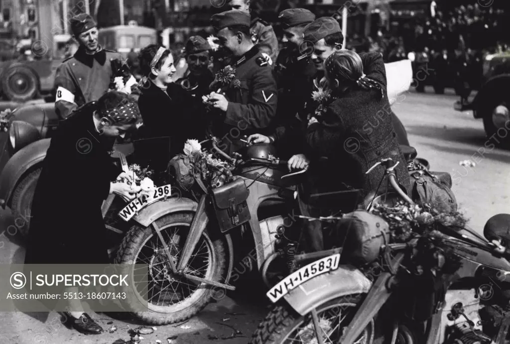 The Germans Enter Sudetenland.Girls decorating dispatch riders and their motor cycles with flowers when they arrived in Eger. October 27, 1938.