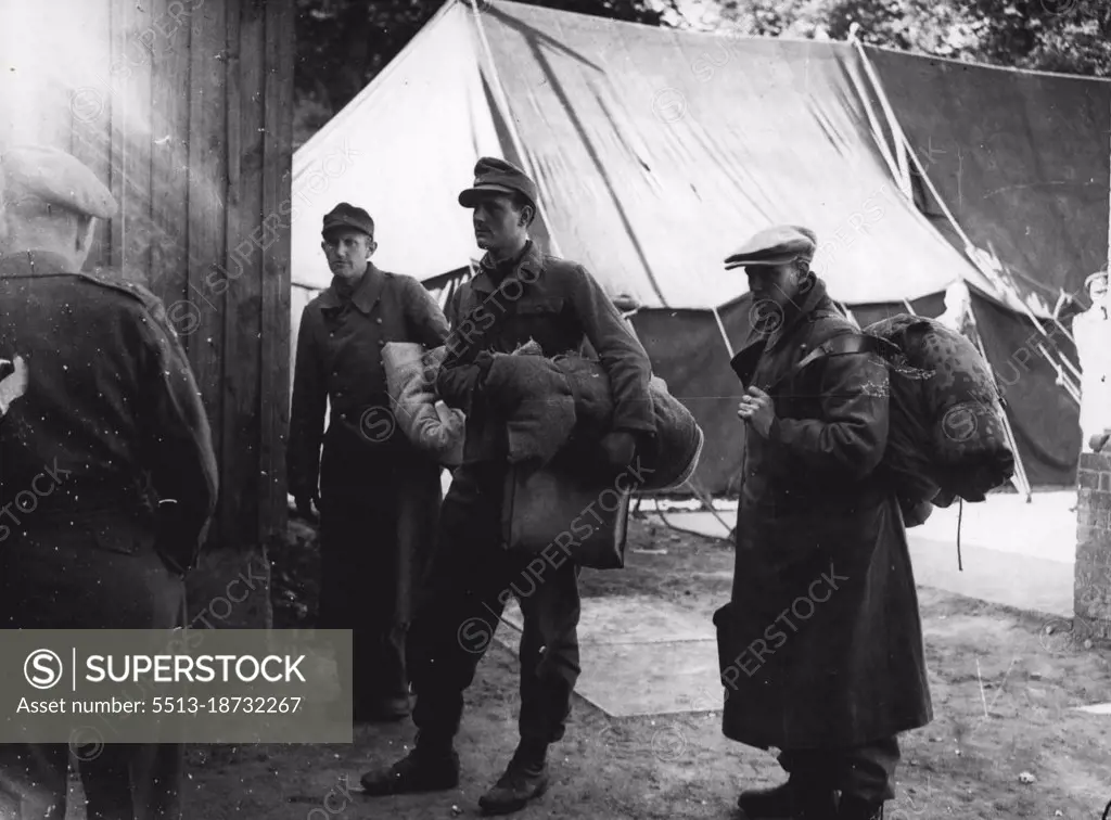 S.S. men unregenerate Nazis arrive at Luneberg after having walked all the way from Munich to testify in Joseph Kramer's behalf. The beast of Belsen has lacked no witness willing to aid in his defense. October 22, 1945. (Photo by Mirror Features).