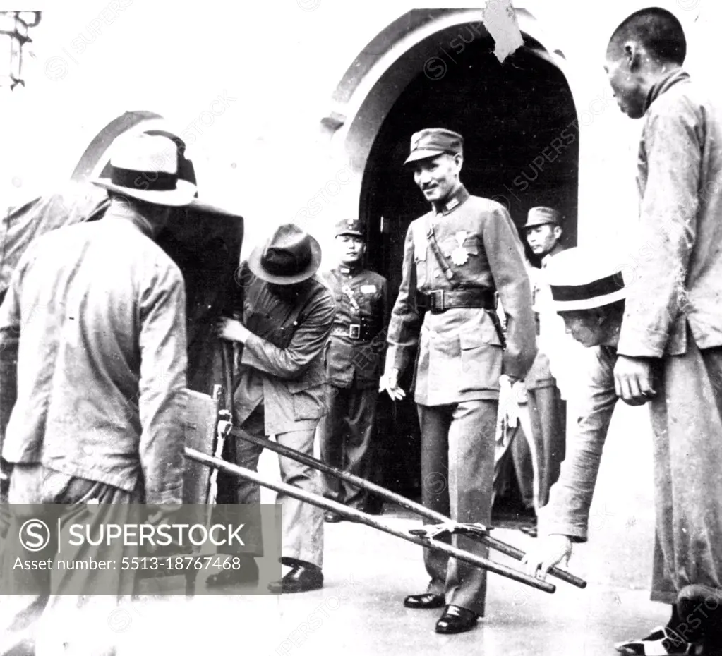 Lu-Shen, central China... Unusual photo of Marshal Cheng Kai-Shek, Chinese dictator, was taken here this morning, just ending the Government meeting which has decided the definite military operation ***** Japanese troops in North China. July 13, 1937. (Photo by The Domei News Photos Service).