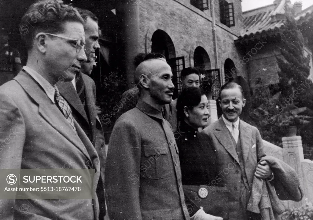 China's Generalissimo And His Indispensable Wife New Picture -- A picture just received of General Chiang Kai-Shek, China's Generalissimo, and Madame Chiang Kai-Shek, his American-educated wife, as they received foreign correspondents at Nanking, seat of the Chinese Government, from where, together, they are controlling China's fortunes in the critical days of the war with Japan. Madame Chiang is her husband's "right-hand woman", acting as his adviser, interpreter and Chief of propaganda. October 18, 1937. (Photo by Planet News Ltd).