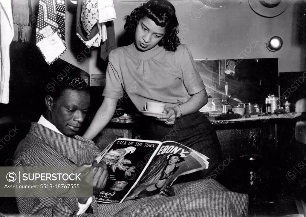 With his Fiancee, Marie Ellington, Cole reads reports of his wedding plans. September 23, 1948. (Photo by France Media Agency).