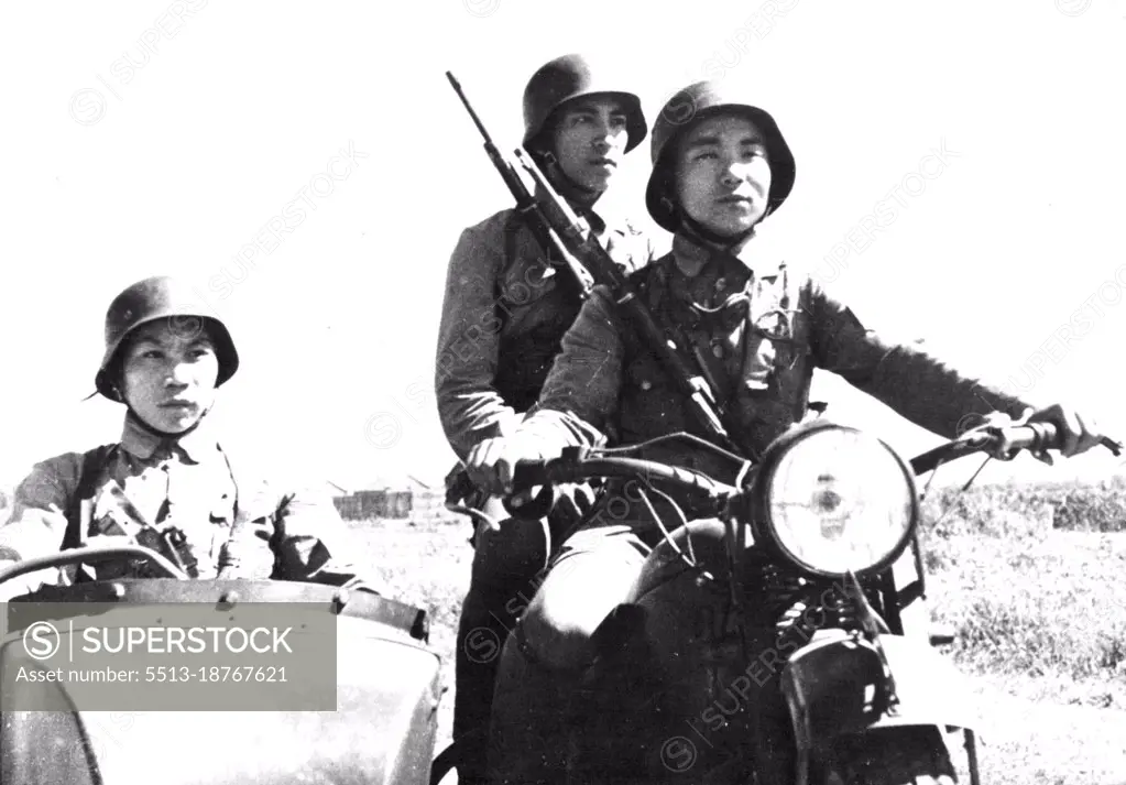 China At War -- The vanguard of a new motorized unit of the Chinese Army is formed by these three soldiers on a motorcycle. September 4, 1944.