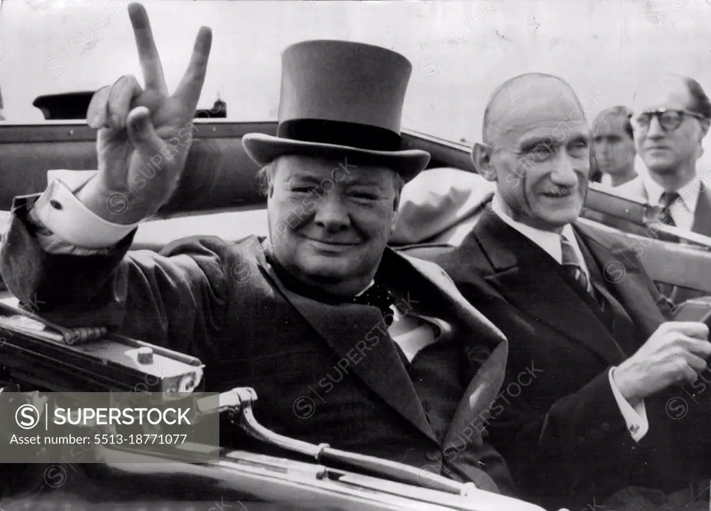 Churchill In V-Humour In Metz -- Mr. Winstons Churchill Ex-Premier, gives his "V" sign as he drives through world famous "V" sign as he drives through cheering inhabitants of the French Town of Metz  on the way to a civil banquet. With him is M. Robert Schuman, French Minister of Finance. July 16, 1946. (Photo by Associated Press Photo).