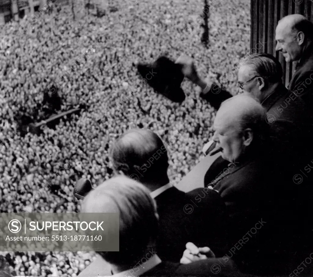 The P.M. and a section of the huge crowd.Ve day Prime Minister addresses Whitehall crowd. From a balcony in the ministry of health building in Whitehall Mr.Churchill addresses a huge crowd. members of the Cabinet were with him on the balcony. June 04, 1945. (Photo by Sport & General Press Agency Limited).