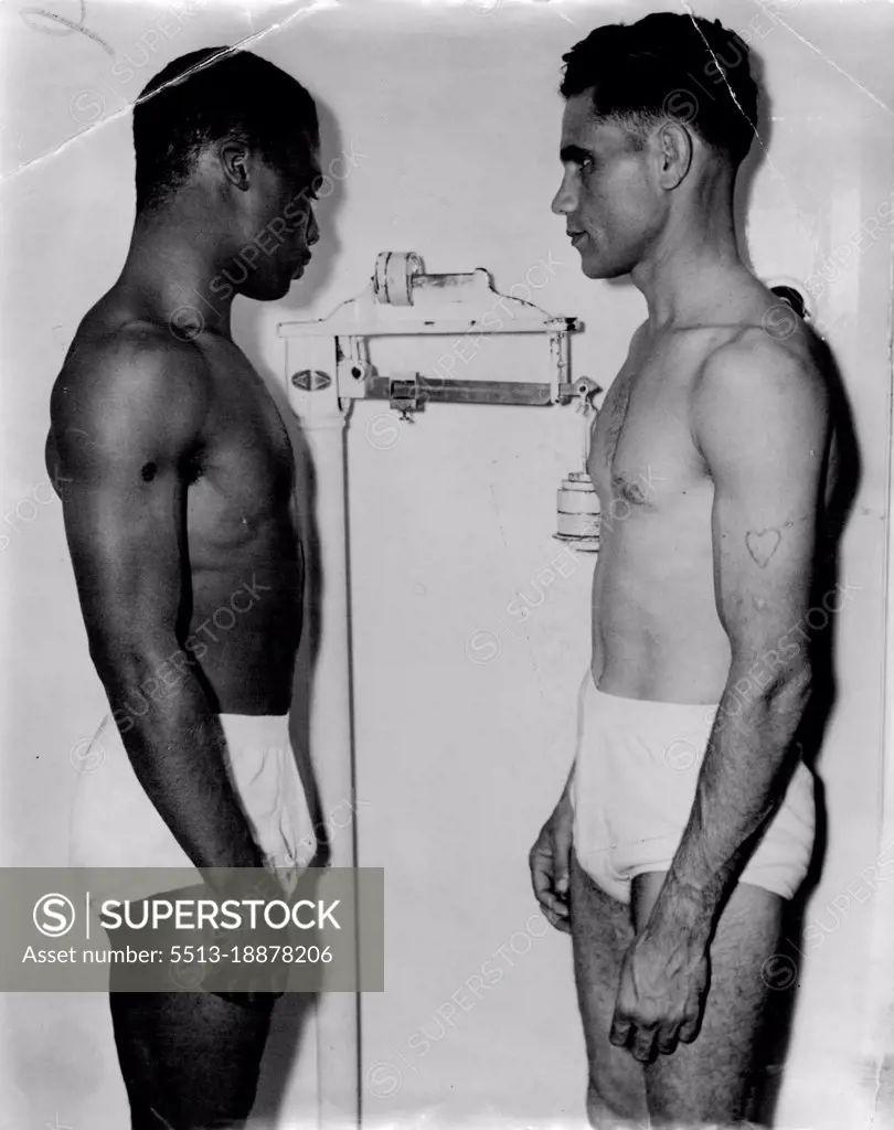 Photograph ***** day's stadium ***** emphasises difference height between Jack Hassen and Tommy Stenhouse. February 07, 1949.