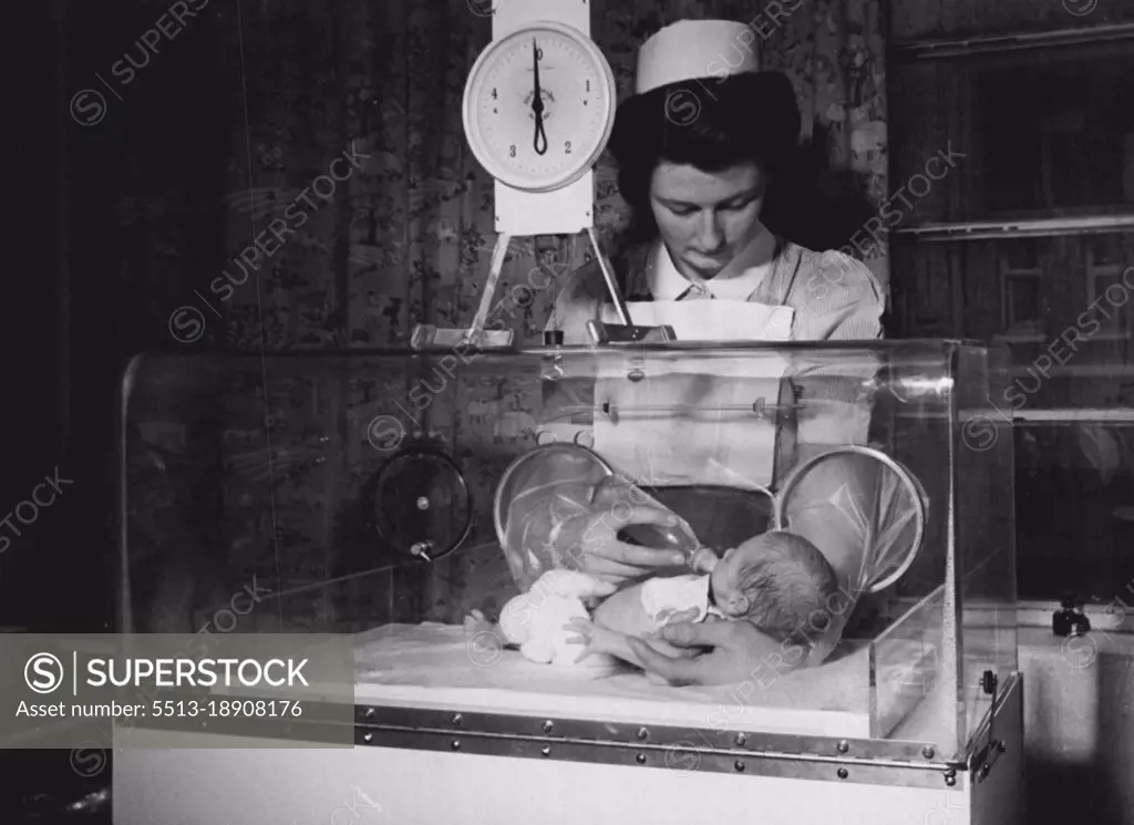 Incubator Baby... This incubator, sent as a gift to Princess Elizabeth from an American firm, was given by her to her doctor, Sir William Gilliatt. It is now at King's College Hospital, London. First baby to use it is Brian Heaney, four weeks old. He has gained 12oz. in it. December 13, 1948. (Photo by Daily Mirror).