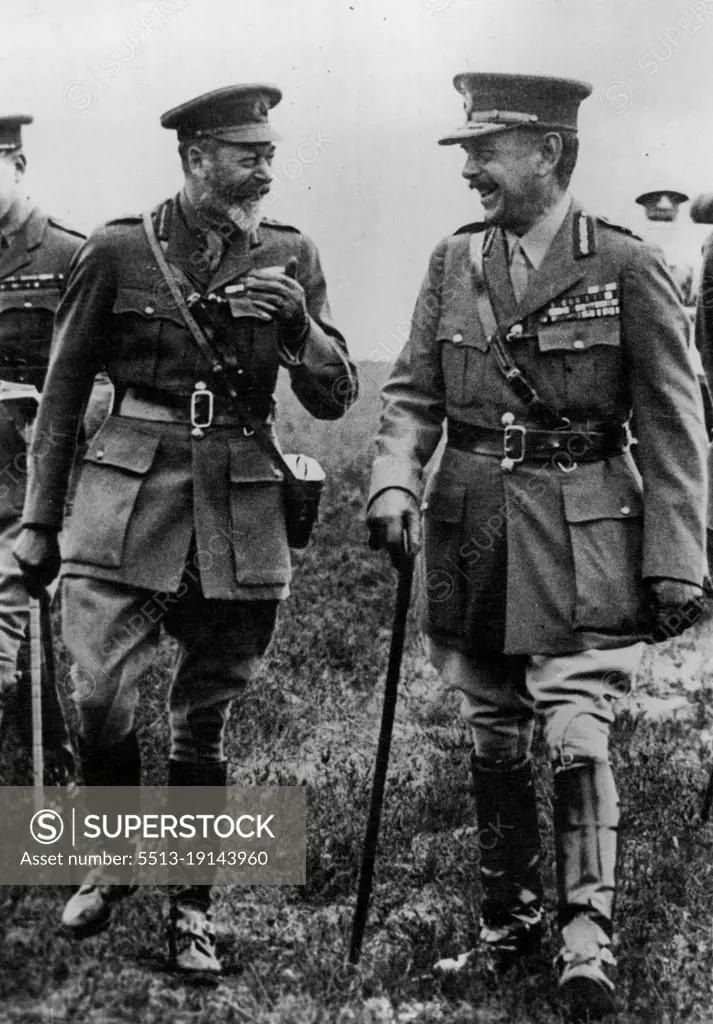 King George on the Western Front with an officer who had the anxious job of looking after him - anxious because the King objected to seeing only the 'safe" areas and whenever opportunity served would contrive to find his way into other sectors. January 14, 1935. (Photo by Empire Press).