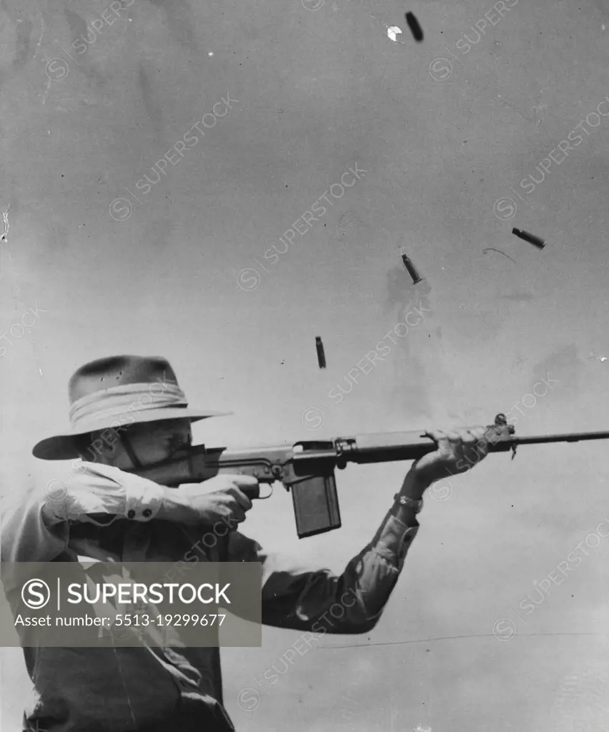 Deadly New Rifle. The Belgian FN.30 rapid-firing ***** will soon replace the Lee Enfield .303 as standard equipment for the Australian services. Split-second photography caught, in midair, the shellcases ejected from the new weapon demonstrated by Lt.-Col. J. E. M. Hall in Melbourne. February 9, 1955.