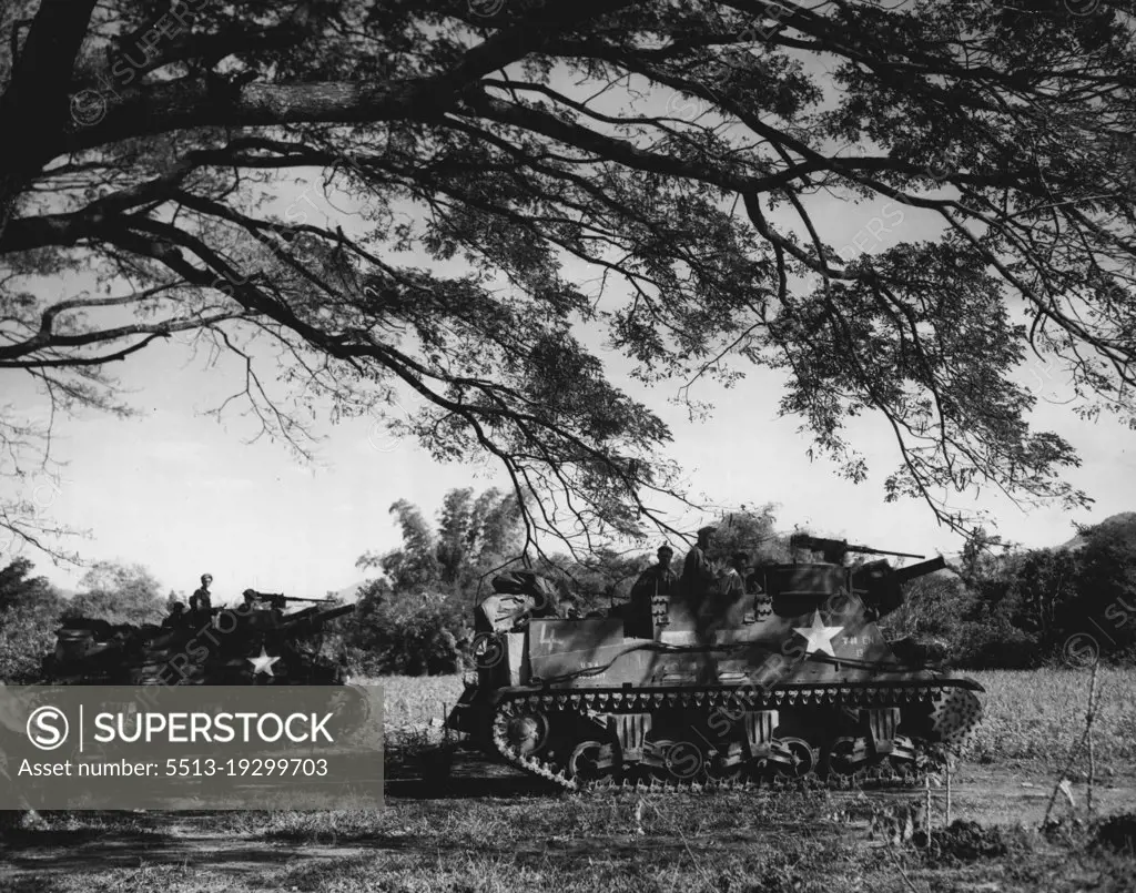 Covering Infantry Advance: Self-Propelled 105mm howitzers, camouflaged by spreading branches, ready to support infantry troops advancing through Southern Luzon. March 5, 1945. (Photo by USA Signal Corps).