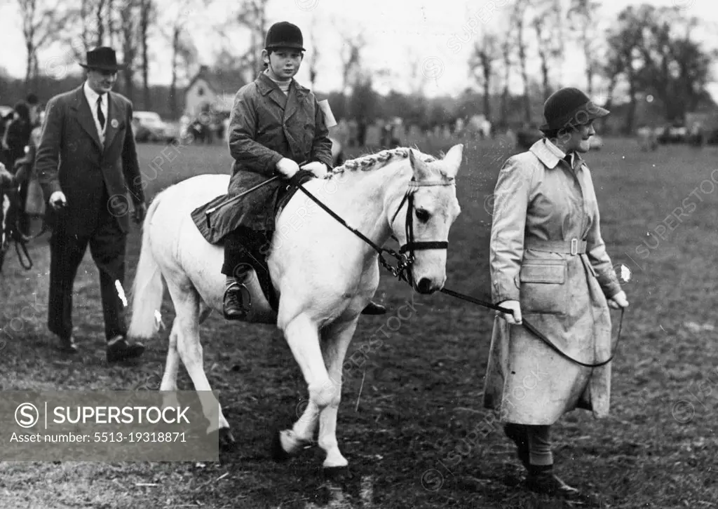 Royal Jumper At Iver Village Horseshow -- Prince Michael of Kent on his white pony "Pearl", pictured as he is led up to the start of the Class II event at Iver Village Children's Horseshow and Gymkhana (Huntsmoor Park, Monday).He won a second prize. April 11, 1950. (Photo by Fox Photos).
