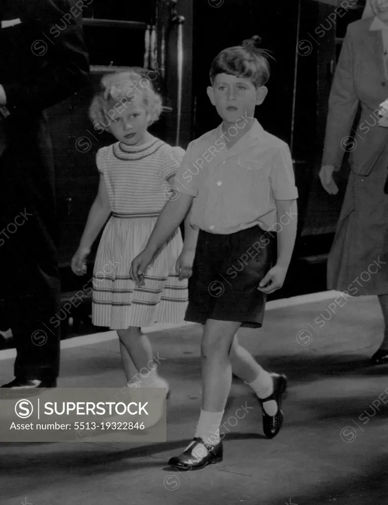 Just To Children Going On Holiday -- In simple holiday dress, Prince Charles and his sister, Princess Anne, walk ***** the train on arrival at Portsmouth to-day (Friday) from London to ***** Royal yacht Britannia.They will join their parents, the Queen and the Duke of Edinburgh, on an eight-day cruise.During this, the Royal couple will be fulfilling engagements in Wales, the Isle of Man, and Scotland. August 05, 1955. (Photo by Reuterphoto).