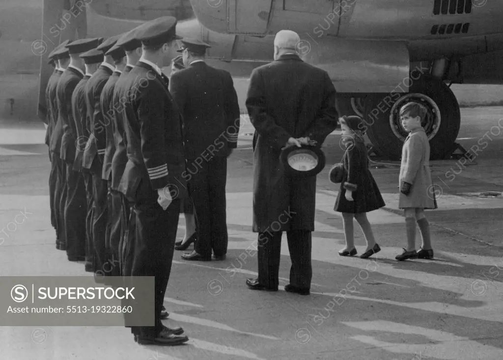 The Princess Is Home -- Little Princess Anne is tip-toe with excitement and Prince Charles is obviously admiring the uniforms of the pilots as H.R.H. Princess Margaret shakes hands with the crew of the Stratocruiser Canopus after landing at London Airport today.H.R.H. Princess Margaret today arrived home after her Caribbean Tour. The Royal Children went with H.M. The Queen H.R.H. The Duke of Edinburgh and the Queen Mother to great the Princess at London Airport. March 03, 1955. (Photo by Fox Photos).