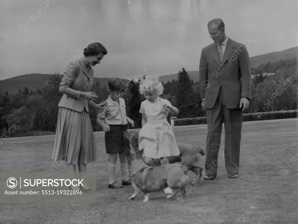 This Embargo Applies To All CountriesRoyal Family at BalmoralQueen Elizabeth and the Duke of Edinburgh, with their children, Prince Charles and Princess Anne, Play with the Queen's Corgi "Sugar" (foreground) and the Duke's "Candy" during the Royal family's summer holiday at Balmoral Castle, Scotland. September 26, 1955. (Photo by Associated Press Photo).