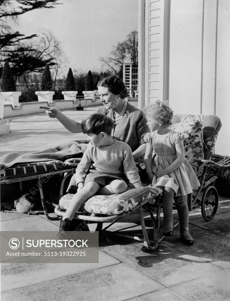At the end of the afternoon the children rest in chairs on the terrace of Royal Lodge with their grandmother. October 18, 1954. (Photo by Lisa).