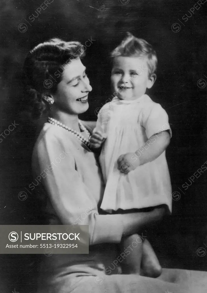 First-Birthday Portrait of Prince Charles With His Mother :A charming first-birthday portrait, by Marcus Adam, of the baby Prince Charles with his mother Princess Elizabeth.The young Prince - who now weighs over 24 pounds, and who is talk for his age - celebrates his birthday on November 14th. November 12, 1949.