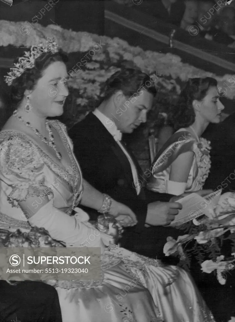 Left to Right, in the Royal box, during the performance, November 25, are: Queen Elizabeth; King Michael of Rumania; and Princess Margaret. The King and Queen accompanied by Princess Margaret, attended a royal command film performance, at the Odeon Theatre, Leicester Square, London, last night, November 25. The performance which also was attended by the queen of Denmark and the king of Rumania, was in aid of hte Cinematograph Trade Benevolent fund. November 26, 1947.