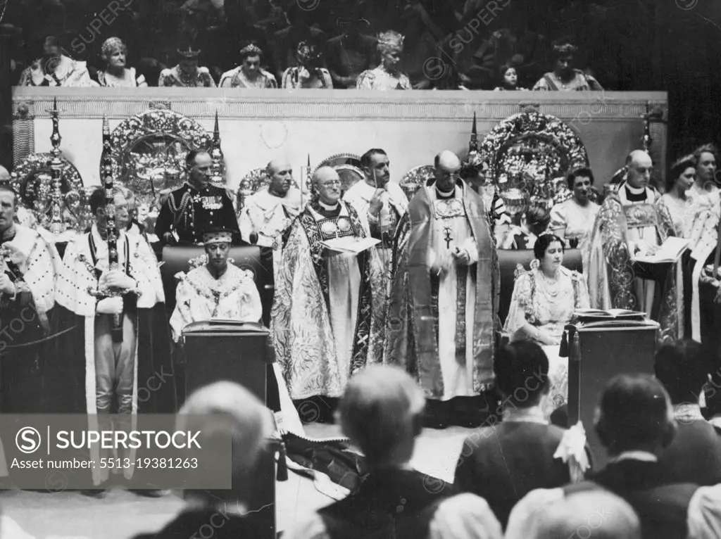 The King And Queen During The Coronation Service -- King George (sitting, on left) and Queen Elizabeth (sitting of right) during the coronation service in Westminster Abbey. The Royal Ladies in the Royal Box above are (left to right, star ONG second from left) Duchess of Kent, Duchess of Gloucester, Queen Maude of Norway, Queen Mary, Princess Elizabeth, Princess Margaret Rose.Amid Glittering Scenes of Traditional splendour the king and Queen rode to Westminster Abbey from Buckingham palace to be crowned. A Buge, colourful Procession accompanied the State coach. February 9, 1952. (Photo by Associated Press Photo).