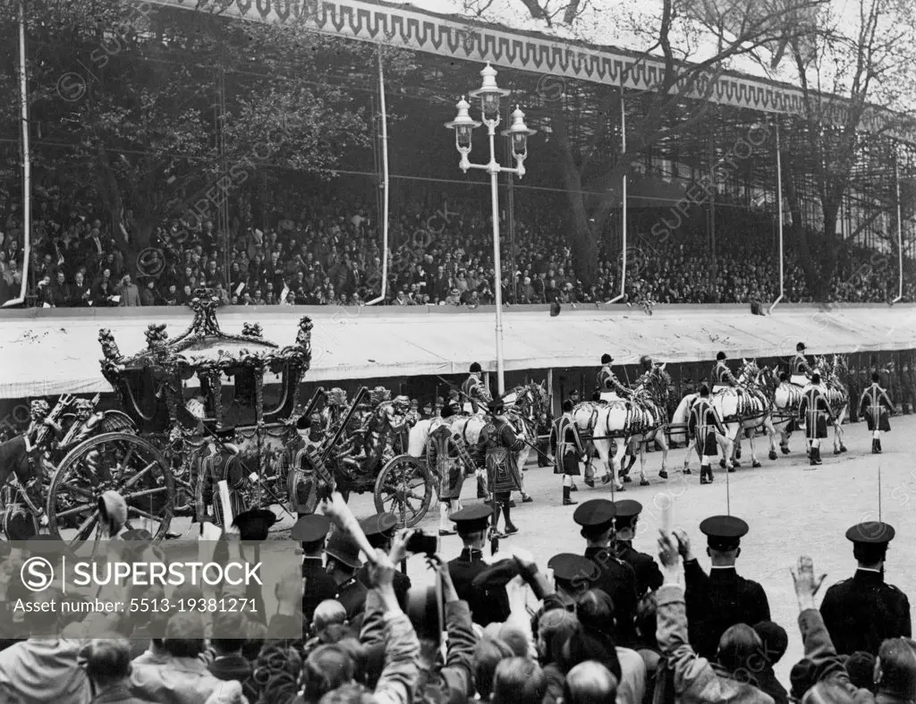 The Coronation of King George VI And Queen Elizabeth -- A view of the Coronation Coach, containing their Majesties, arriving at Westminster Abbey, The Queen is clearly seen bowing to the people lining the route. May 12, 1937. (Photo by Photographic  News Agencies Ltd.).