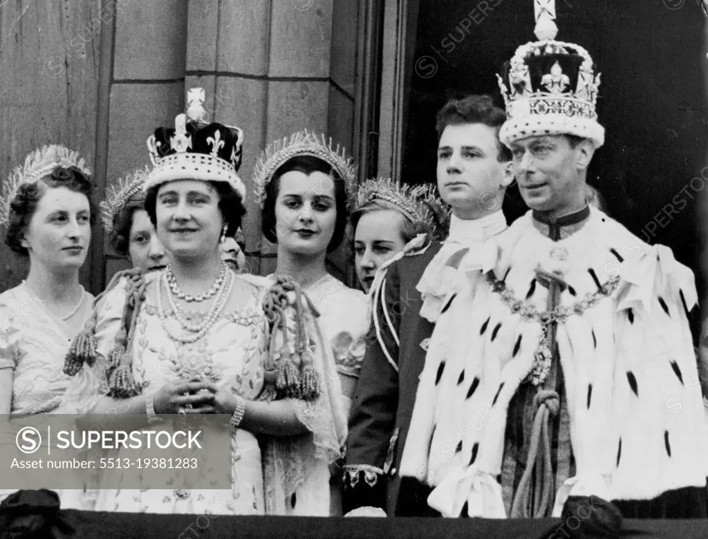 King And Queen Receive The Homage Of Their Subjects -- The King and Queen, still in their ermine robes, and Crowns, photographed on the balcony of Buckingham Palace this evening, when they were acclaimed by tremendous crowds. May 12, 1937. (Photo by Keystone).