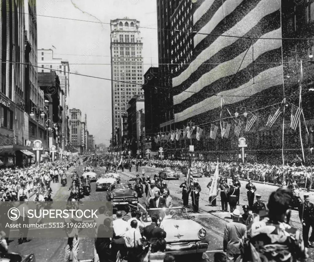 Flag Day Parade For Ike -- A car bearing General Dwight D. Eisenhower (center) makes its way slowly down Woodward Ave., here today on the way to City Hall where the general made a short, non-political speech. Thousands line the line of march to see Eisenhower while others threw confetti and paper from windows. At City Hall, 40,000 persons stood in a hot sun and repeated the Pledge of Allegiance with him at the end of his Flag Day address. June 14, 1952. (Photo by AP Wirephoto).