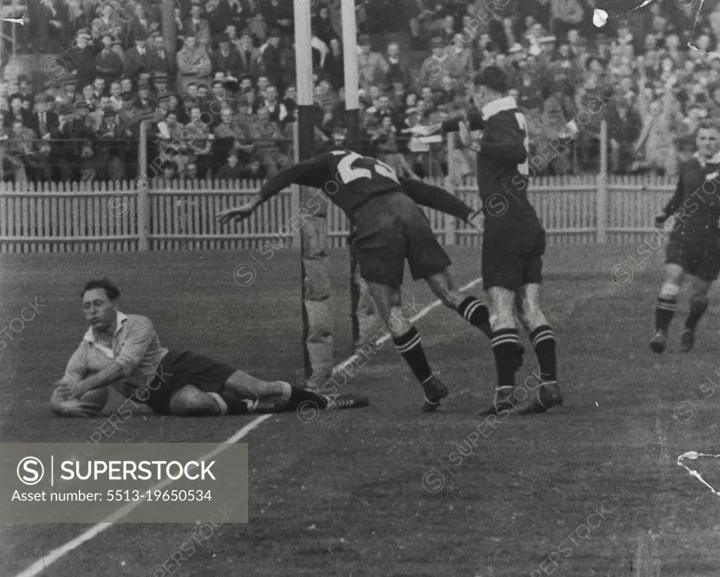 He touches down in vain, while pursuer appears to drape himself around a post.But Windon beats them both and gets another try due to shrewd backing-up and penetrative ability. June 22, 1947.