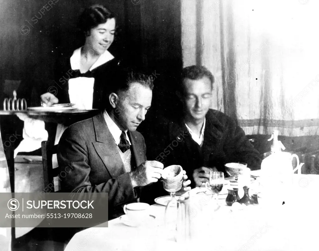 An American Breakfast On English Soil After Flying The AtlanticClyde Pangborn, left and Hugh Herndon enjoying their first real meal after flying across the Atlantic in their Plane "Miss Veedol". This picture was taken at Croydon where they stopped after a short visit to Wales. They remained at Croydon only a short time before continuing their attempt to encircle the world. They gave up the globe circling flight after reaching Siberia. August 07, 1931. (Photo by International Newsreel).