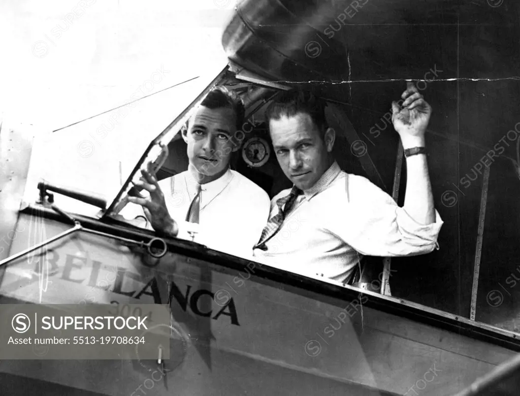 On Your Mark--Get Set --Hugh Herndon, left, and Clyde Pangborn in the Cockpit of their plane all set for their contemplated hop across the Atlantic ocean. They will most likely be the newest members to the exclusive "Ocean-Crossers" club whose ranks have swollen this year in unprecendented fashion. They will try to Gridle the Entire Globe. June 26, 1931. (Photo by International Newsreel Photo).