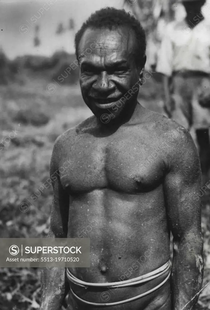 Close-up of Kai-Kai native in full dress (note shell covering). February 16, 1951. (Photo by The Sun Features Bureau).